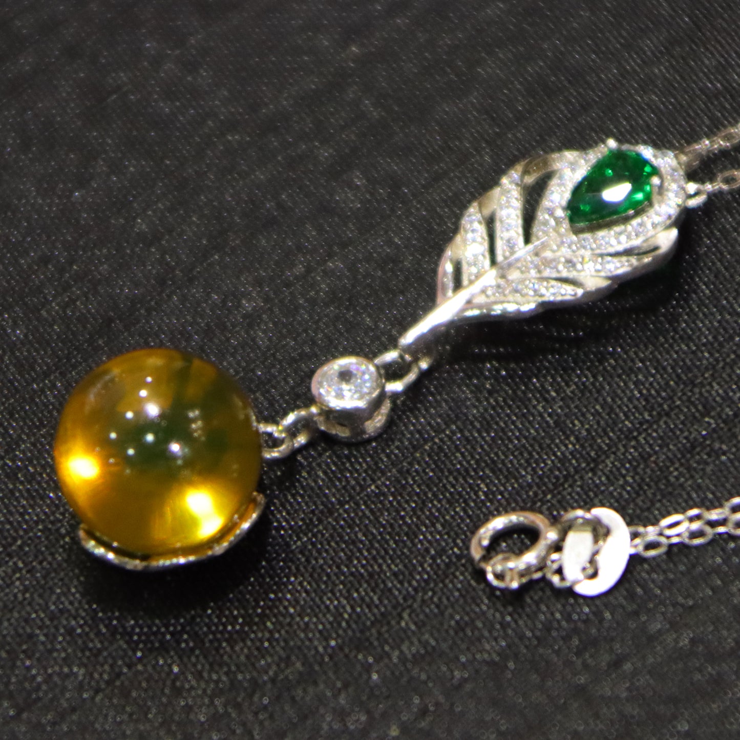 925 Sterling Silver Pendant with Natural Mexico Blue Amber Gemstone and Zircon Green Gemstone Feather Clasp